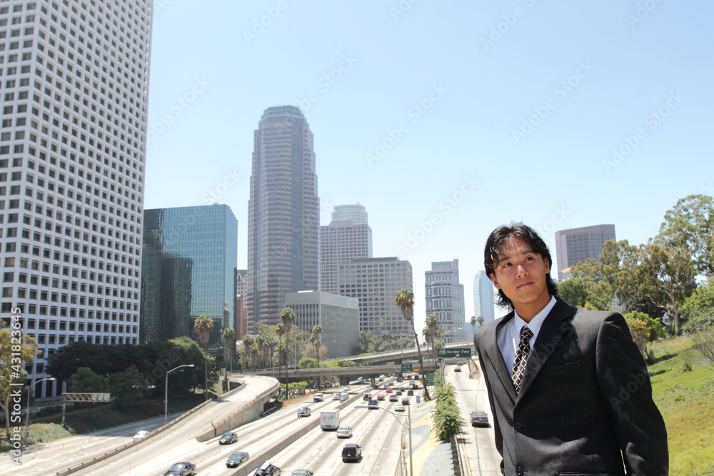 Young Japanese businessman walking in the american business district
Young Japanese businessman walking in the american business district