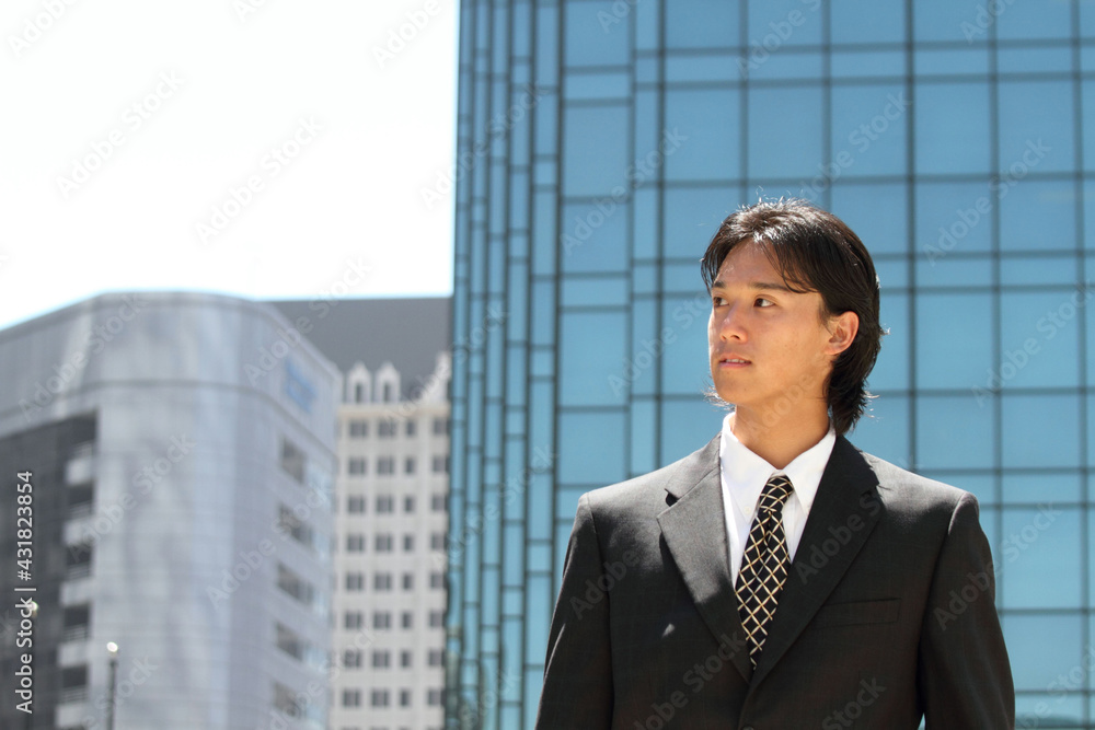 Young Japanese businessman walking in the american business district
Young Japanese businessman walking in the american business district