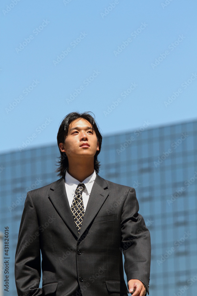 Young Japanese businessman walking in the american business district
Young Japanese businessman walking in the american business district