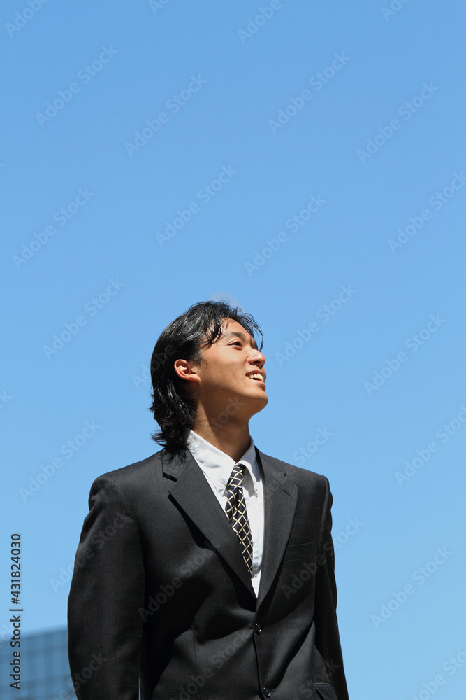 Young Japanese businessman walking in the american business district
Young Japanese businessman walking in the american business district