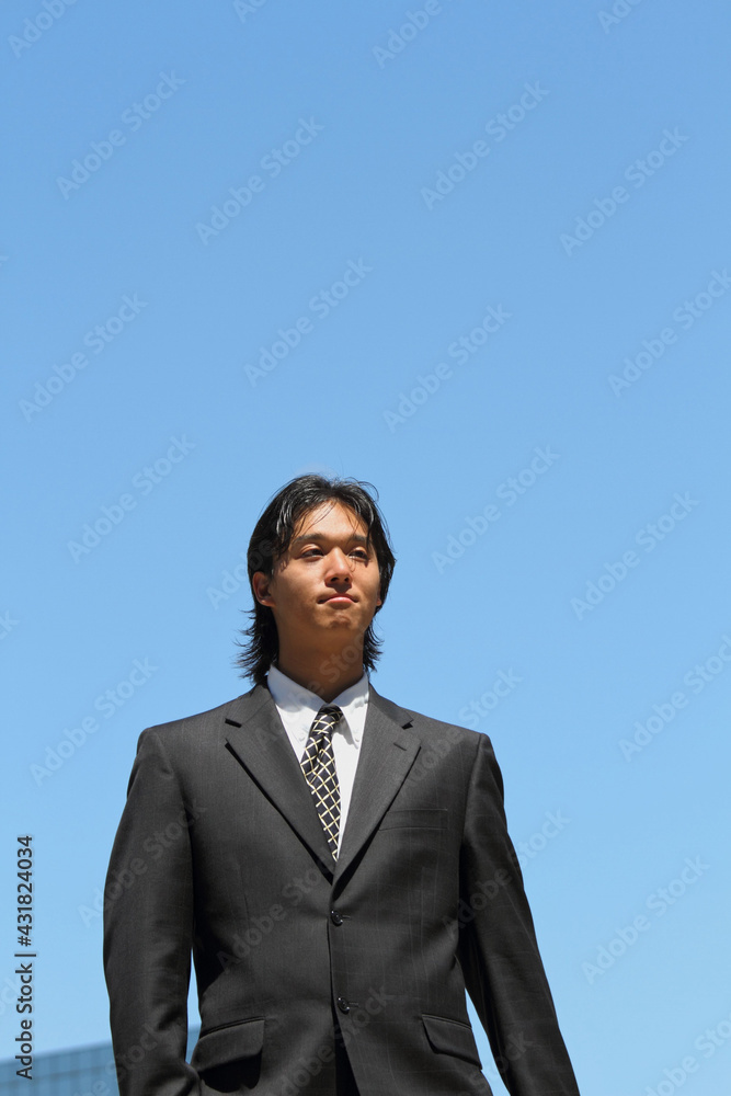 Young Japanese businessman walking in the american business district
Young Japanese businessman walking in the american business district