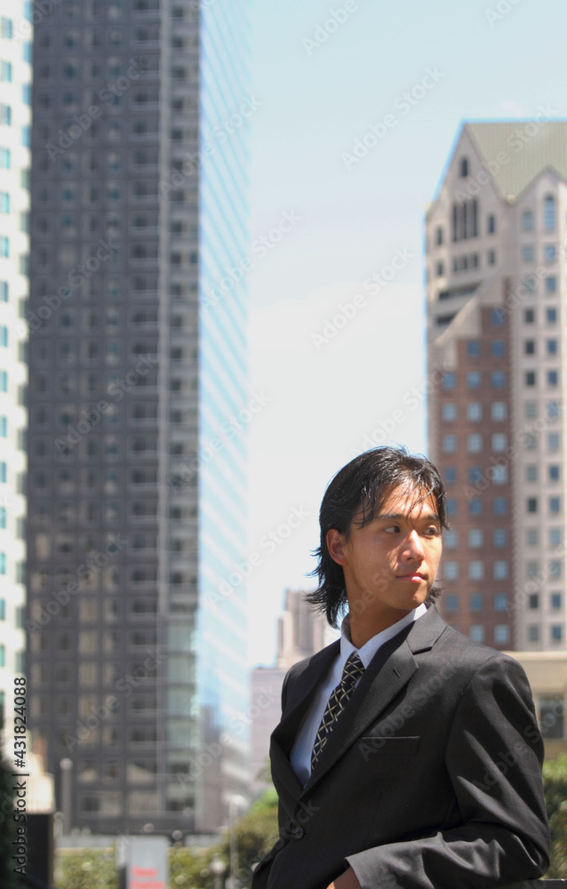 Young Japanese businessman walking in the american business district
Young Japanese businessman walking in the american business district