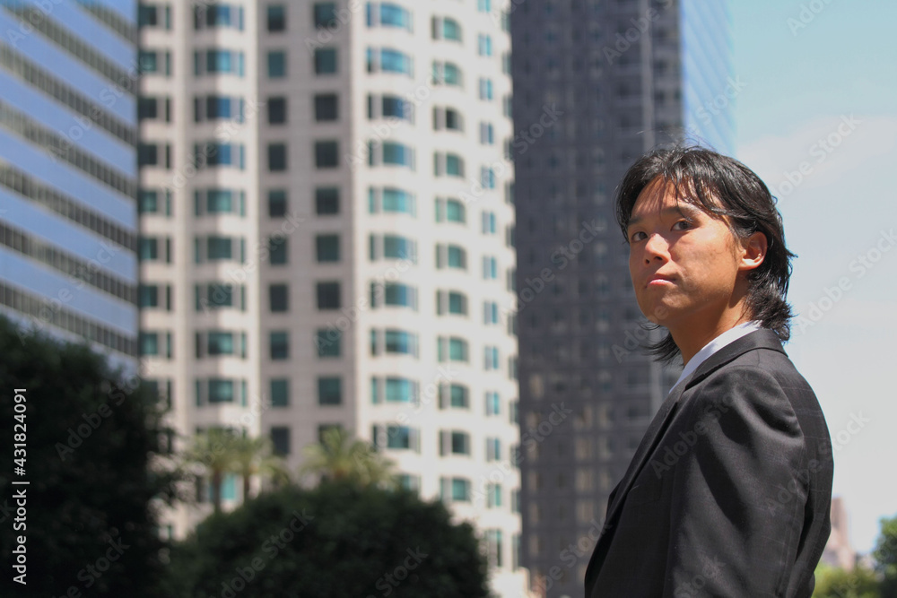 Young Japanese businessman walking in the american business district
Young Japanese businessman walking in the american business district