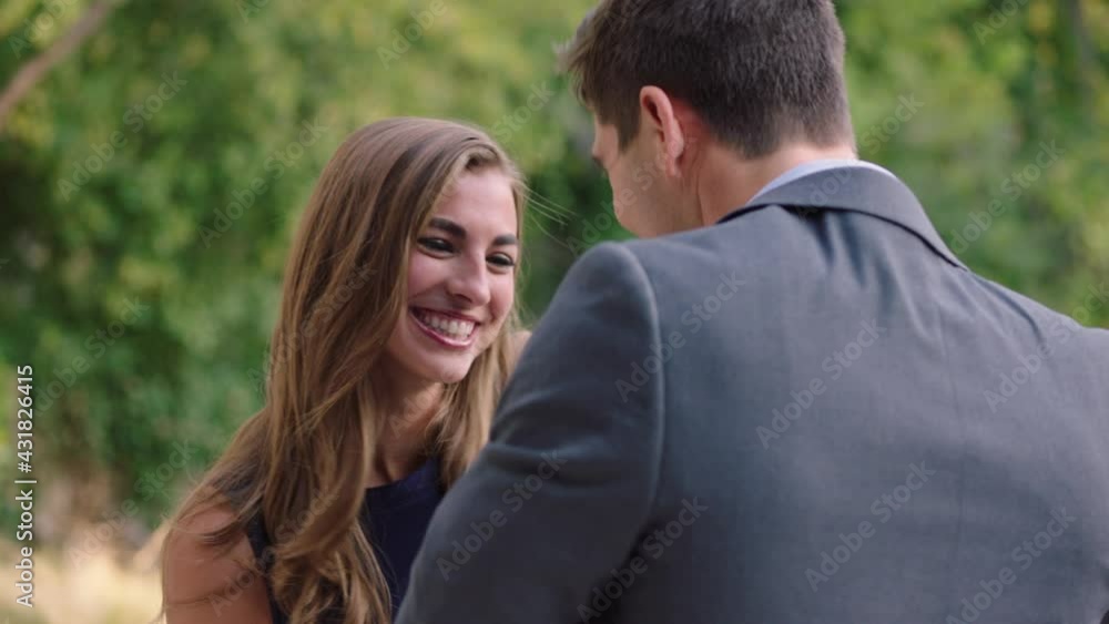 Caucasian couple flirting, woman jumping into mans arms Caucasian couple flirting, woman jumping into mans arms