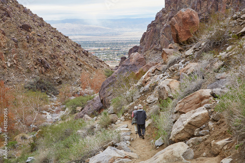 Hiking through the rugged rocks and boulders overlooking Palm Springs California USA