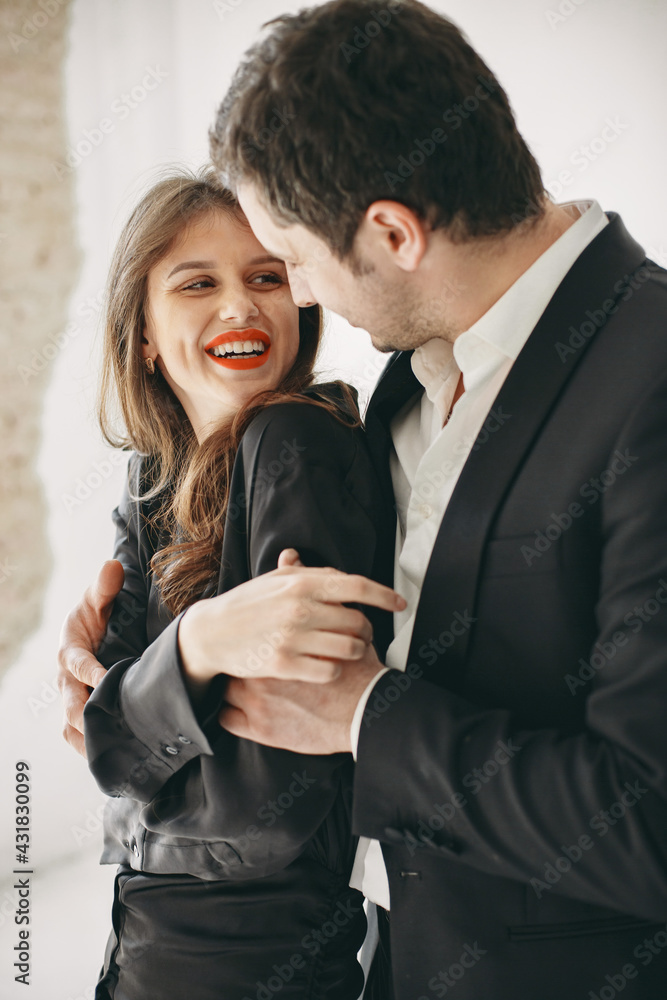 Portrait of young couple in love posing at studio Portrait of young couple in love posing at studio