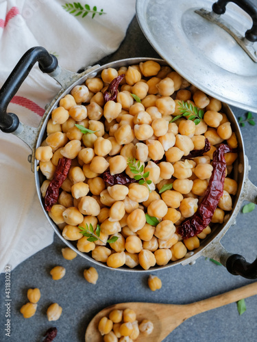 Popular homemade healthy snacks / Steamed Chickpeas with Dried Chili and Curry Leaves / Steamed to perfection, soft and tender, with a tinge of spiciness and curry leaf fragrant, add salt to taste photo