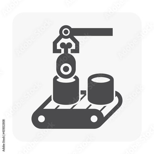 An industrial robot arm carefully transfers and assembles components on a conveyor belt, showcasing the efficiency and precision of automated manufacturing processes.