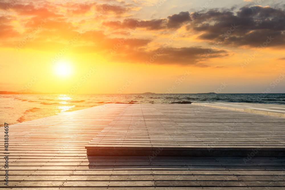 Empty wooden square and sea landscape at sunset.