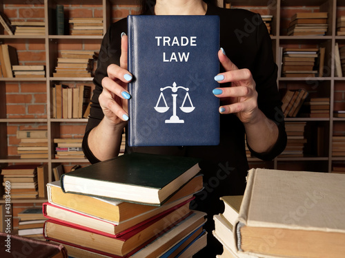 TRADE LAW book in the hands of a attorney. The rise in prominence of trade law following the creation of the World Trade Organization