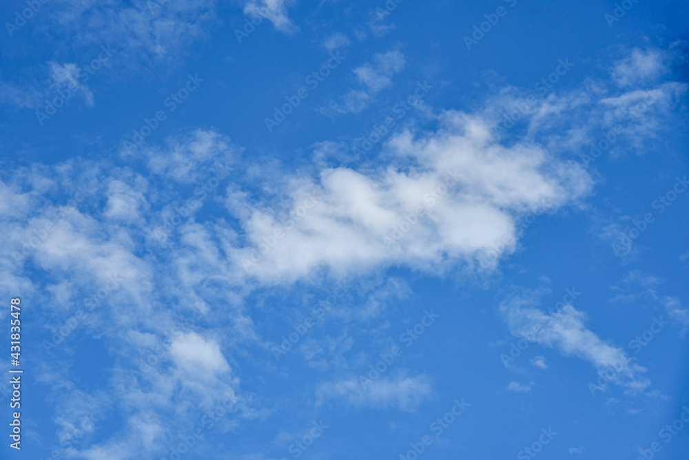 Beautiful white clouds on blue sky background.