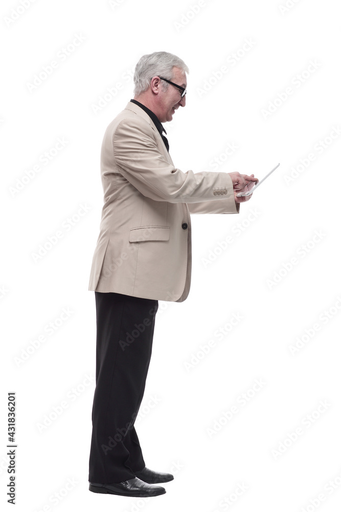 in full growth. Mature intelligent man with a digital tablet. in full growth. Mature intelligent man with a digital tablet.