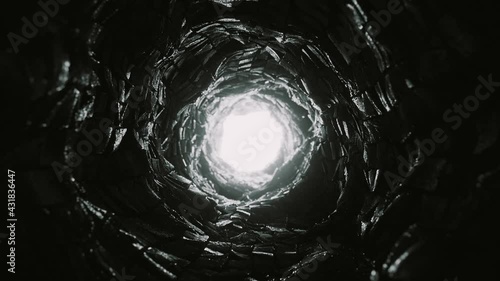 Dark Scary Stone Tunnel. Light at the end of the round cave. Looped video.