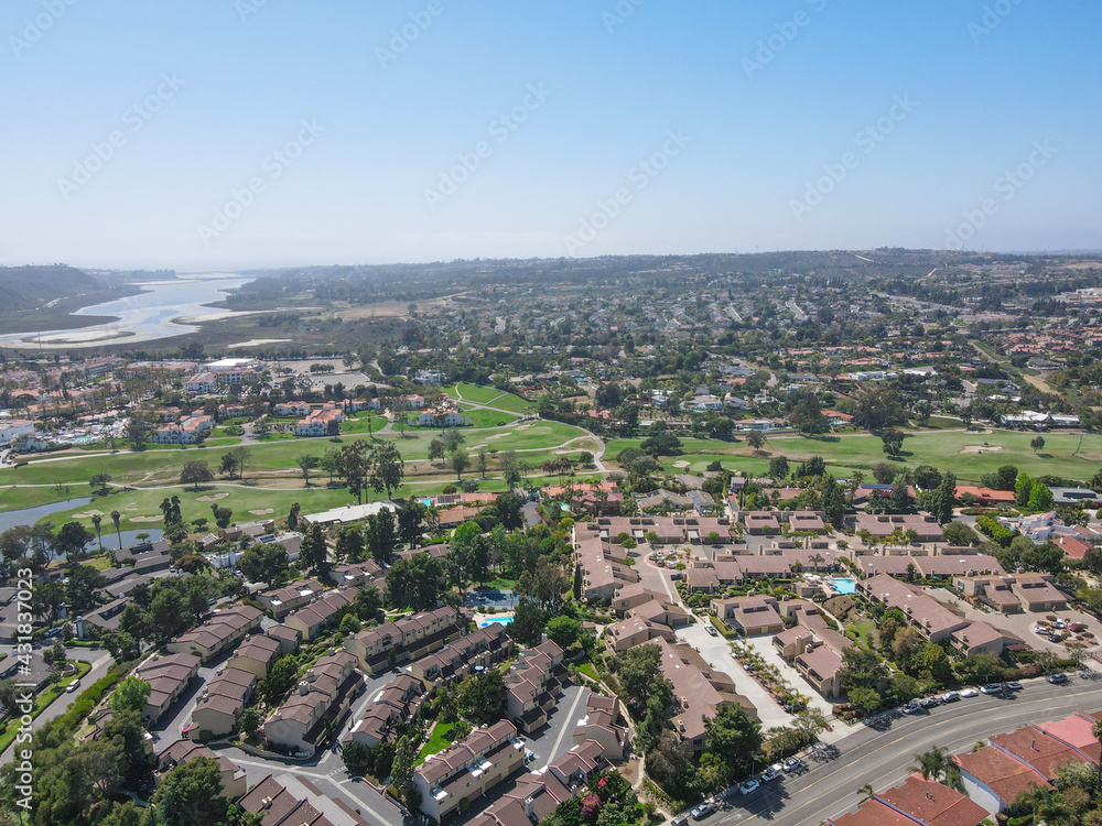 Aerial view of houses and condos with golf in Carlsbad, North County San Diego, California, USA.