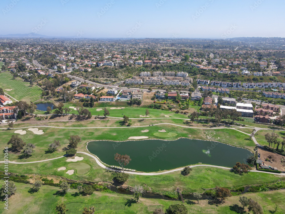 Aerial view of golf surrounded by villas and condos with golf in Carlsbad, North County San Diego, California, USA.