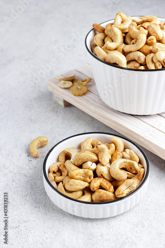 Kacang mede or mete, Fried cashew nut is a snack from Indonesia usually served on Eid al-Fitr.  its nuts are dried and then fried in a variety of flavors.