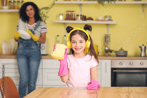 Cute little girl cleaning t...