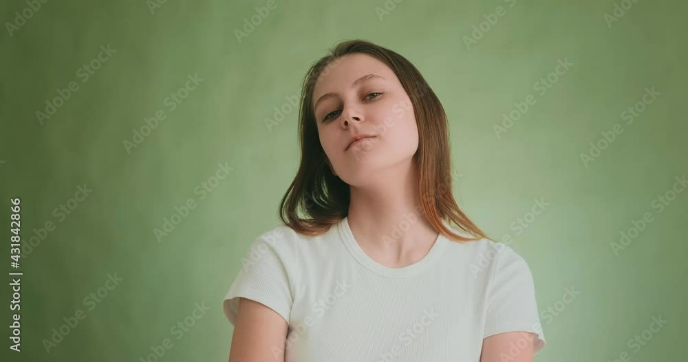 Pretty proud lady with long blonde hair on green background Pretty proud lady with long blonde hair on green background
