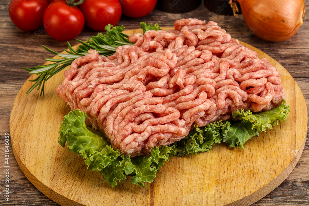 Raw pork minced meat over board Raw pork minced meat over board