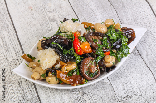 Pickled asian mushroom mux with herbs photo