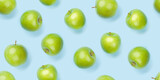 Green apple fruits over blue seamless
