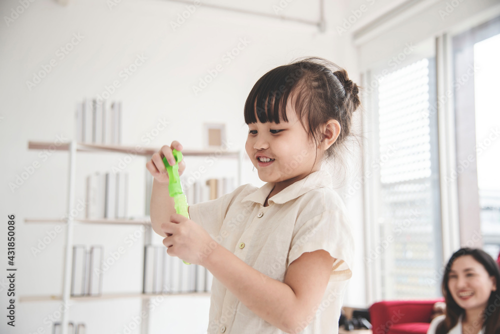 Kid is learning to understand tutoring with her home mom, feeling happy at her home away from COVID-19