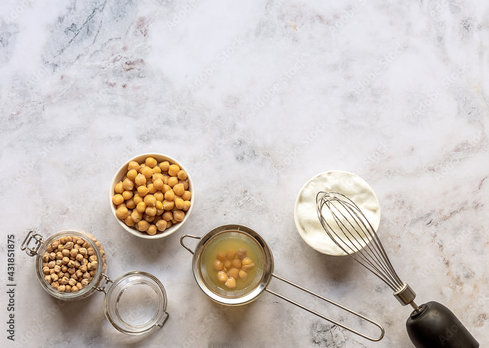 Canned chickpea aquafaba. Egg replacement and substitutes. Vegan cooking concept. whipped foam in a bowl. Top view, copy space. Canned chickpea aquafaba. Egg replacement and substitutes. Vegan cooking concept. whipped foam in a bowl. Top view, copy space.