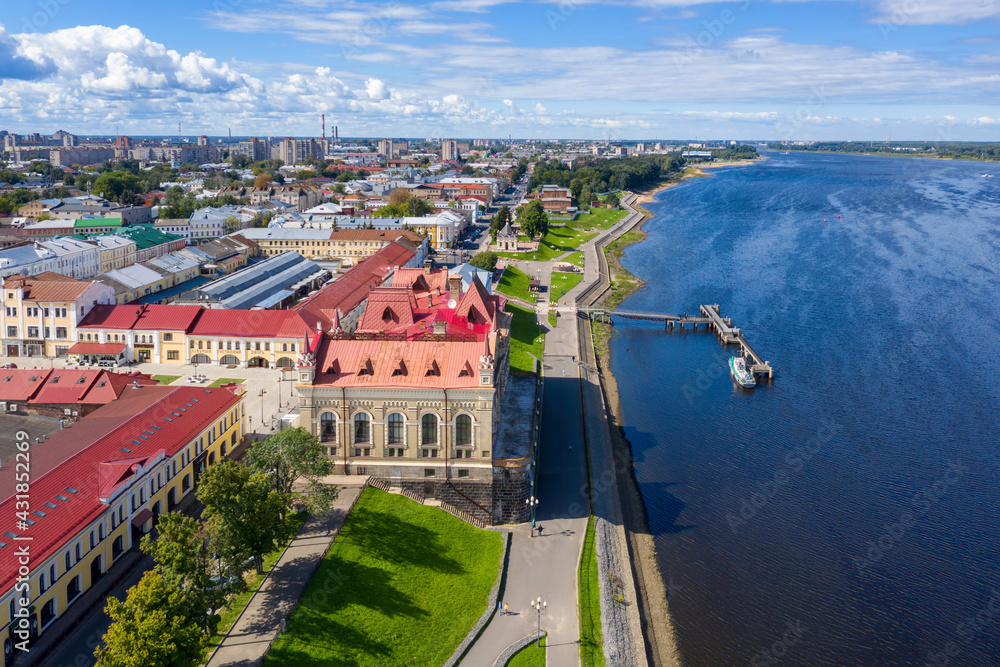 Aerial view of local history museum and Volga river embankment on sunny day. Rybinsk, Yaroslavl Oblast, Russia.
