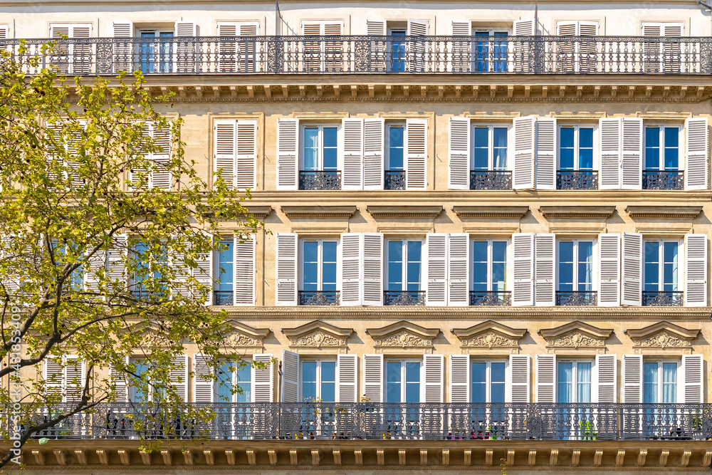 Paris, beautiful facade in the center, geometry of the windows Paris, beautiful facade in the center, geometry of the windows