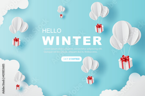 Balloons gift fly on air blue sky. Hello winter concept. paper art of balloon white floating and Gift Box on in the air blue sky for Merry Christmas and Festival poster. design paper craft and cut