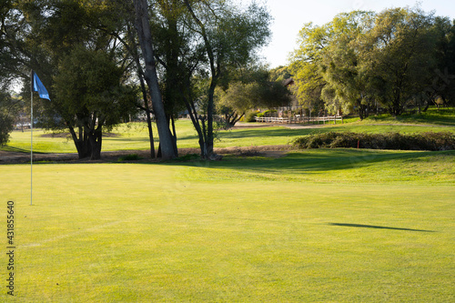 Putting green on a beautiful golf course.