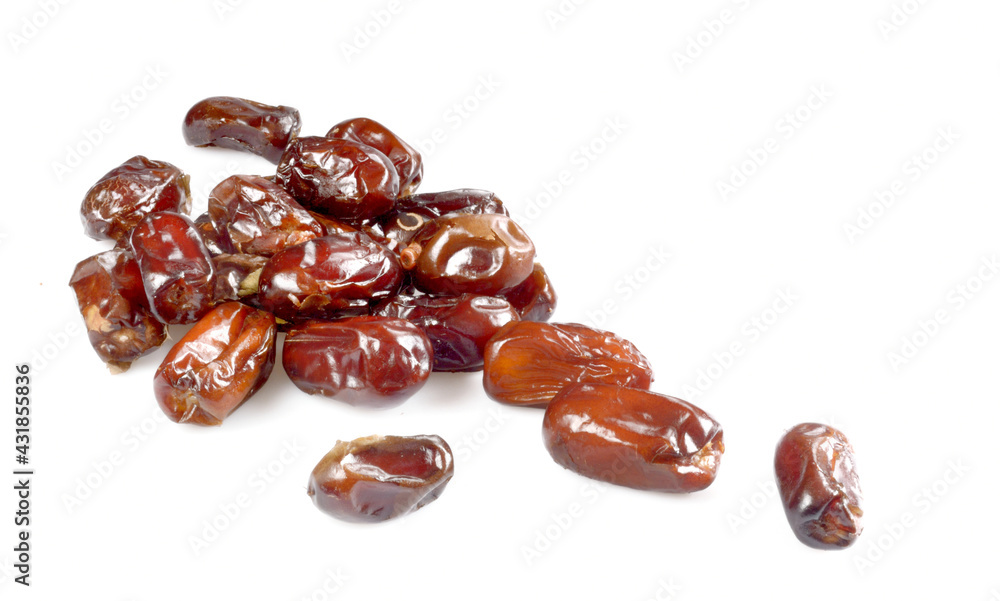 dried dates sprinkled on a white background dried dates sprinkled on a white background