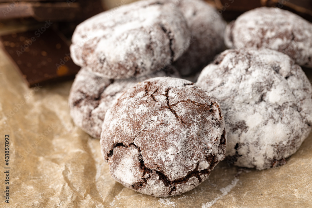 Chocolate cookies powdered with sugar close up Chocolate cookies powdered with sugar close up