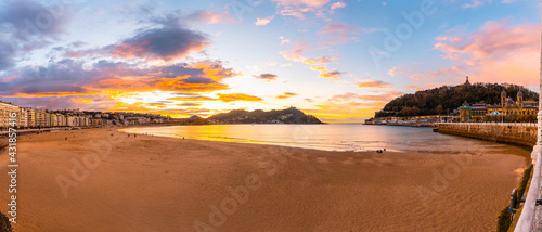Panoramic at sunset on the beautiful beach of La Concha in the city of San Sebastian, in the province of Gipuzkoa in the Basque Country photo