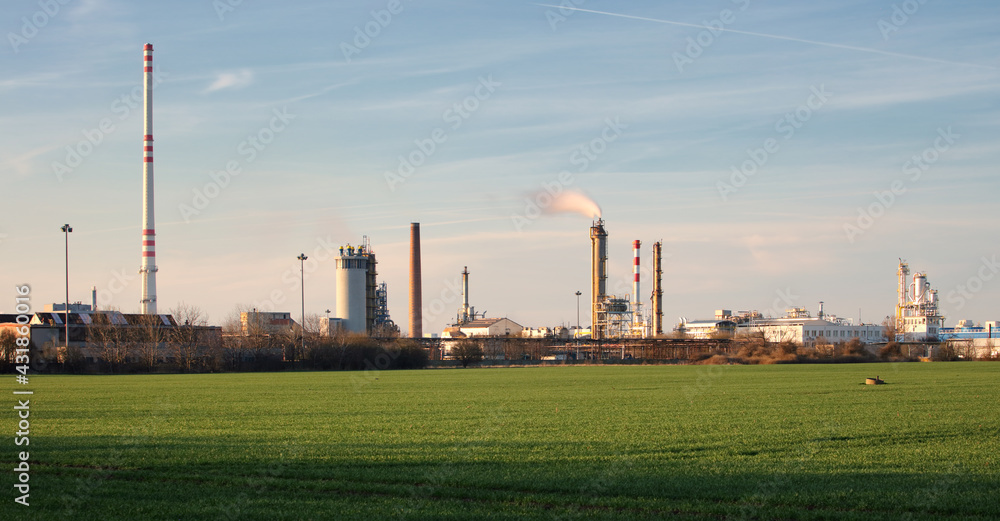 Smoking chimneys of a petrochemical factory in an oil refinery