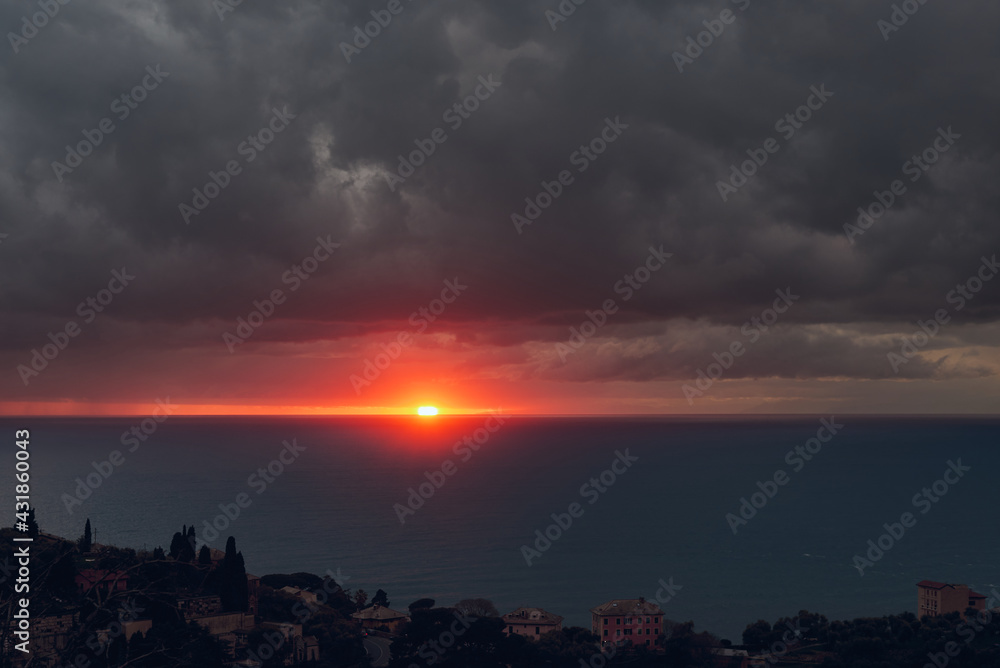 sunset over the sea in Recco, Liguria, Italy