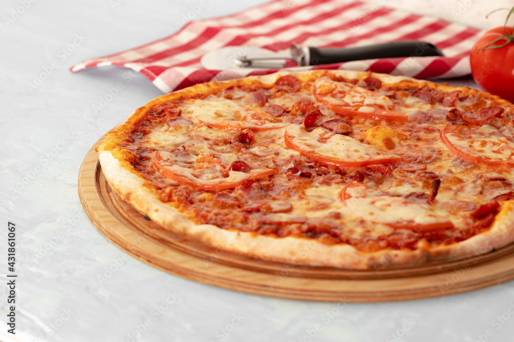 Freshly baked pizza on table close up Freshly baked pizza on table close up