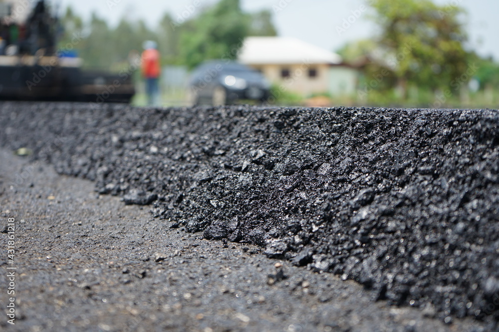 The image is blurred in the construction of asphalt road. The image is blurred in the construction of asphalt road.