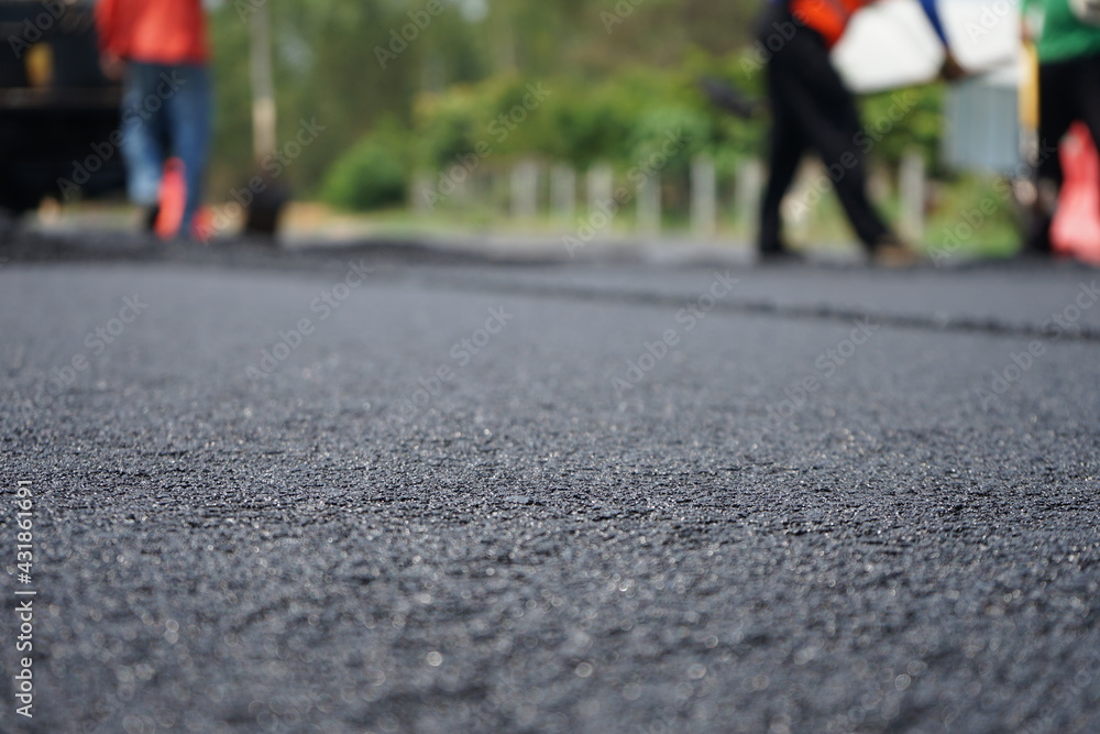 The image is blurred in the construction of asphalt road. The image is blurred in the construction of asphalt road.