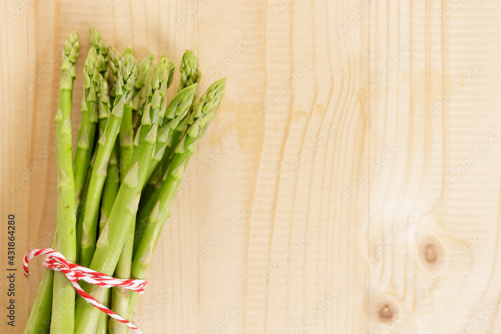 Fresh green asparagus on wooden table background. Fresh green asparagus on wooden table background.