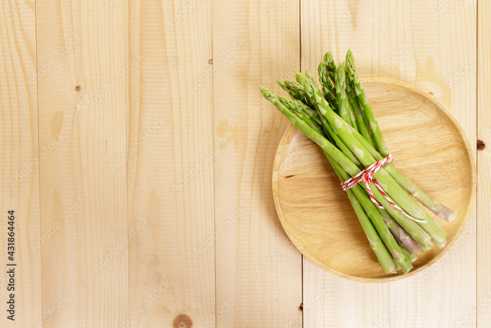 Fresh green asparagus on wooden table background. Fresh green asparagus on wooden table background.
