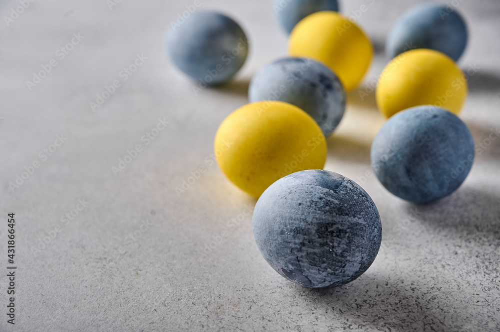 Homemade Easter colored yellow and grey marble eggs. Close up, selective focus Homemade Easter colored yellow and grey marble eggs. Close up, selective focus
