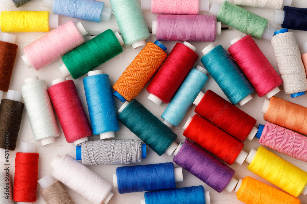 Close up of colored thread coils, thread spools background Close up of colored thread coils, thread spools background