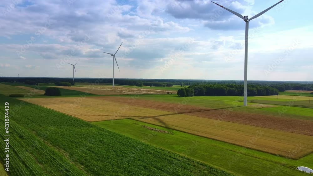 Line of wind energy turbines in summer Line of wind energy turbines in summer
