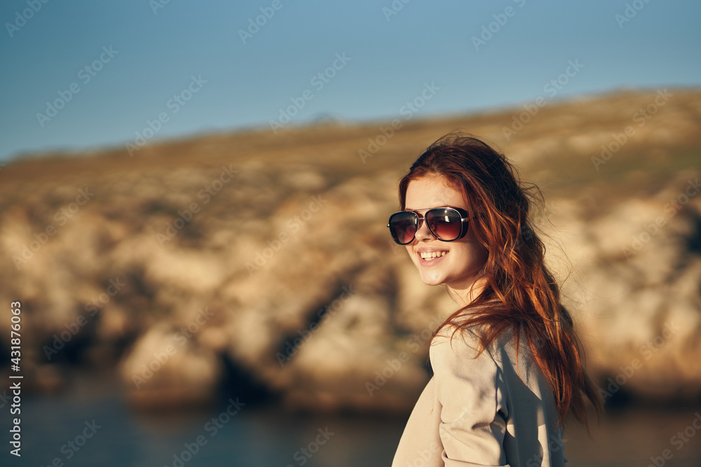 woman with glasses and red hair sweaters t-shirt mountains landscape