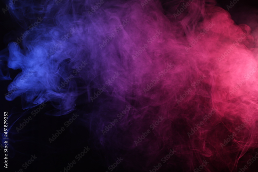 Obraz premium Smoke in red-blue light on black background