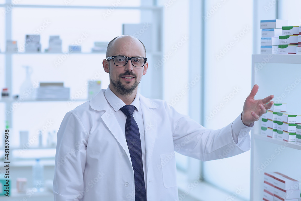 Pharmacist is working. Man wearing special medical uniform located in pharmacy. Pharmacist is working. Man wearing special medical uniform located in pharmacy.