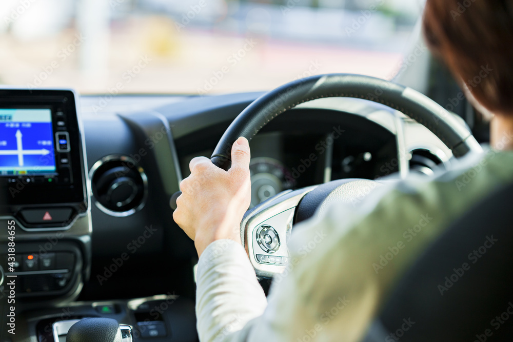 japanese middle aged woman using car navigation system japanese middle aged woman using car navigation system