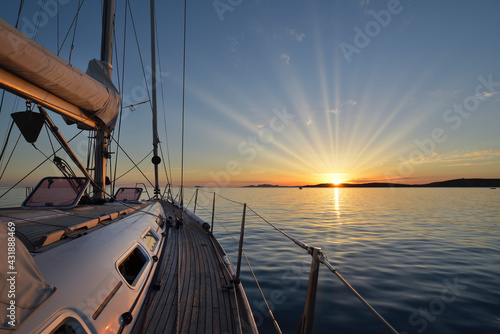 Fototapeta Naklejka Na Ścianę i Meble -  Mediterranean Sea - Anchoring in the sea at sunset on a sailing boat in Sardinia
