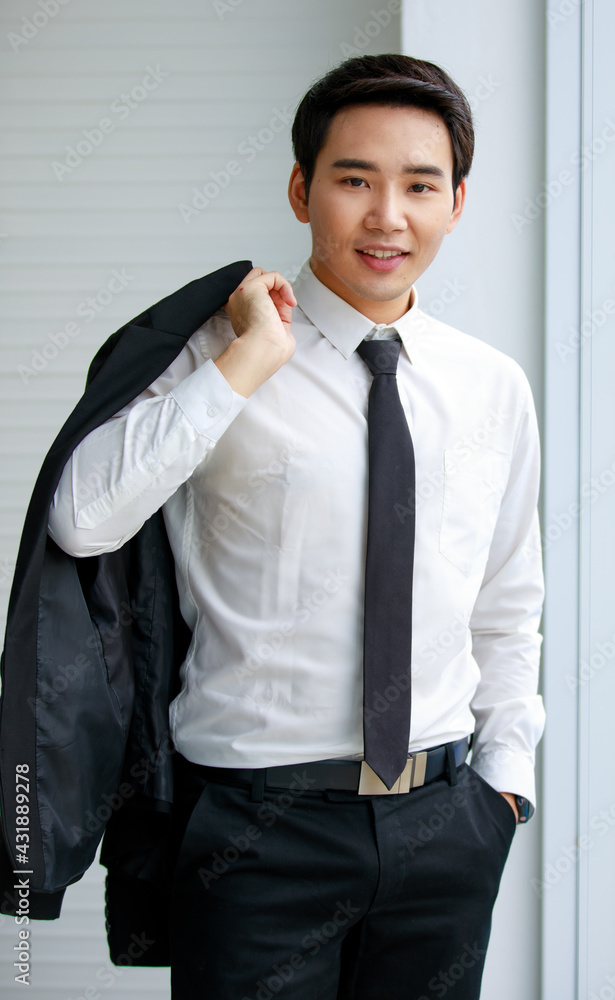 Asian men wearing white shirts, black tie, short hair, dark eyebrows  smiling standing looking camera Hand